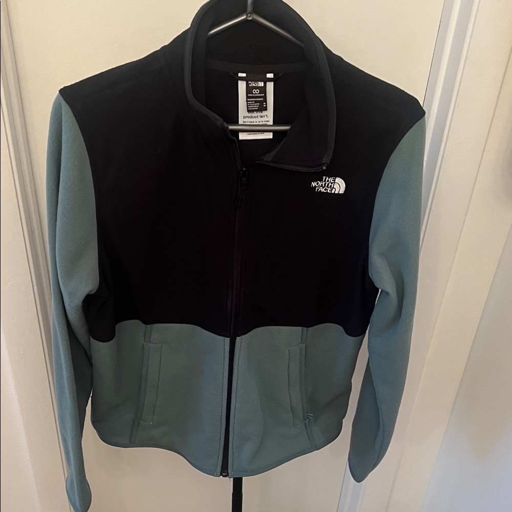 The North Face Black and Teal Fleece Jacket. Worn only 1 time! Like NEW!